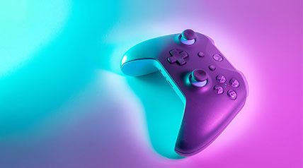 X Box gaming console controller with orchid and ice blue lighting